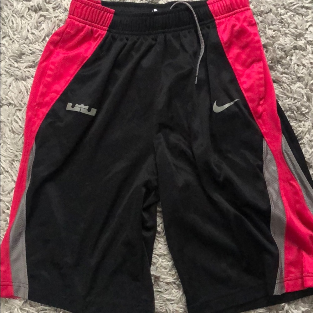 Pink and black NIKE basketball shorts